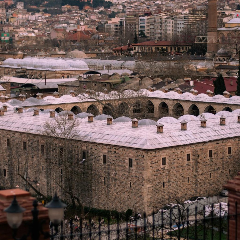Aerial view of historic Ottoman architecture in Bursa, Türkiye, showcasing the city's unique cultural heritage.