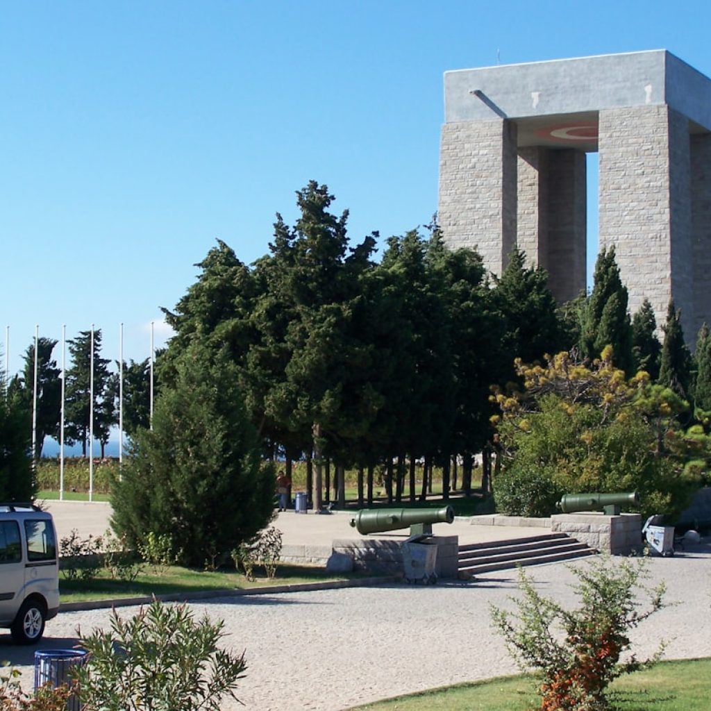 a building with a tower and trees