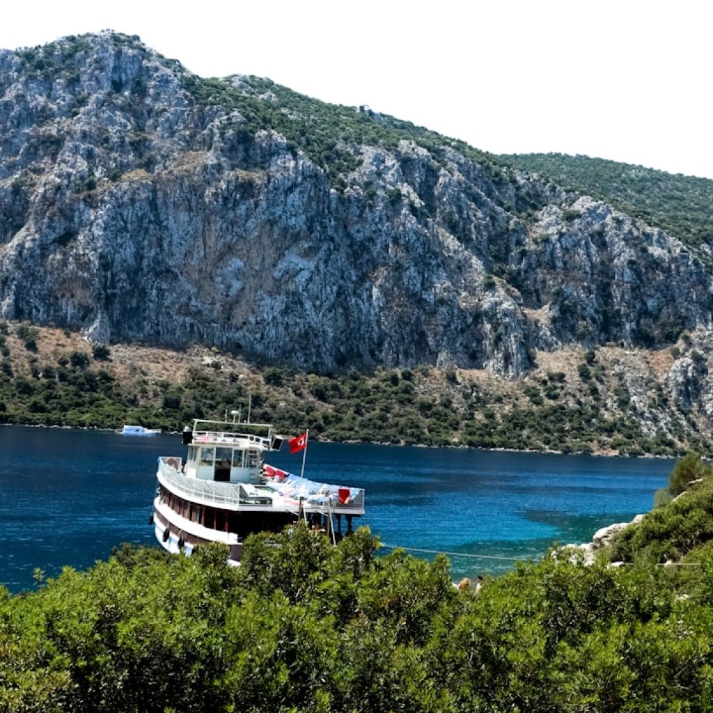 a large boat floating on top of a body of water