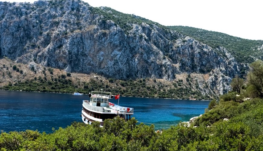 a large boat floating on top of a body of water