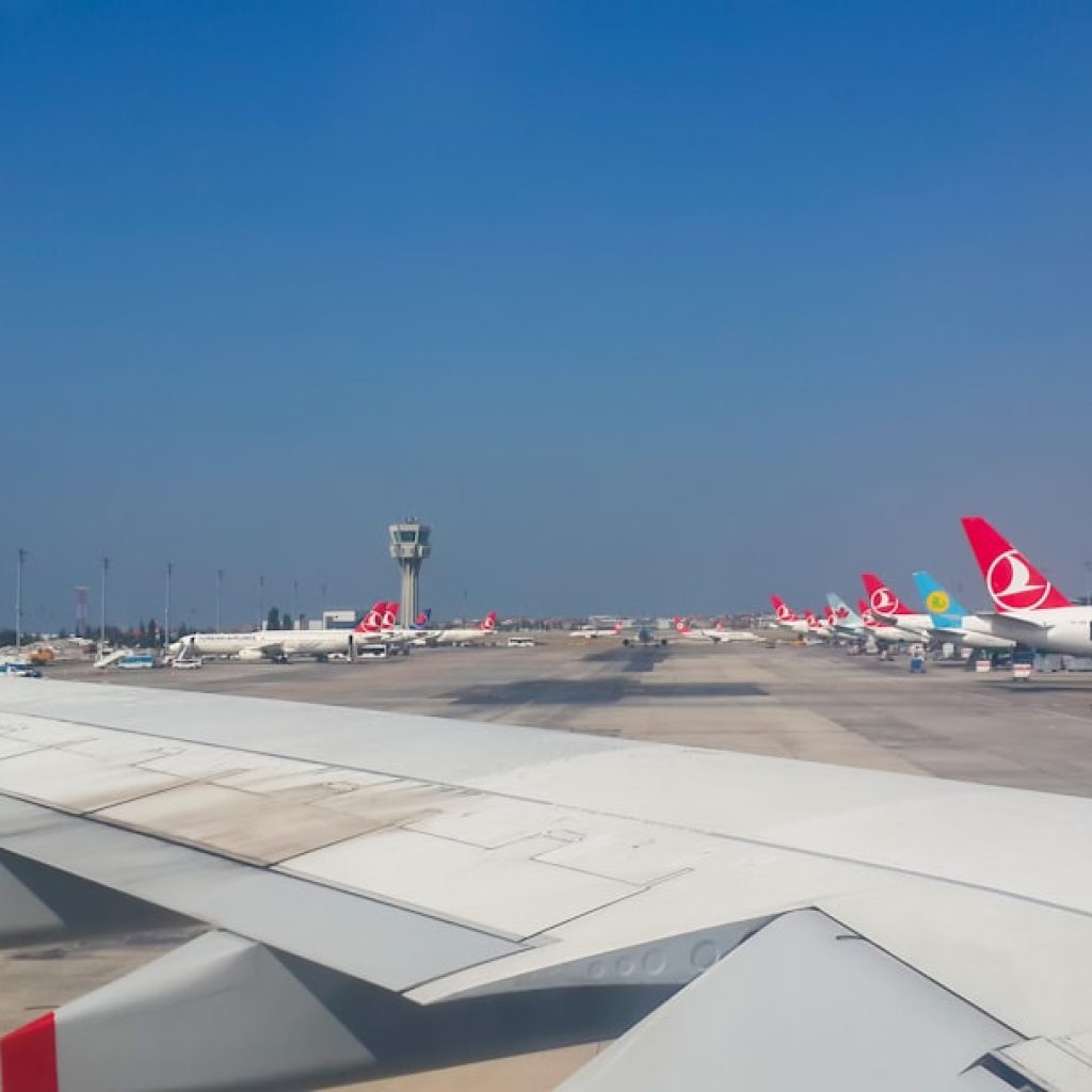 a bunch of airplanes that are on a runway