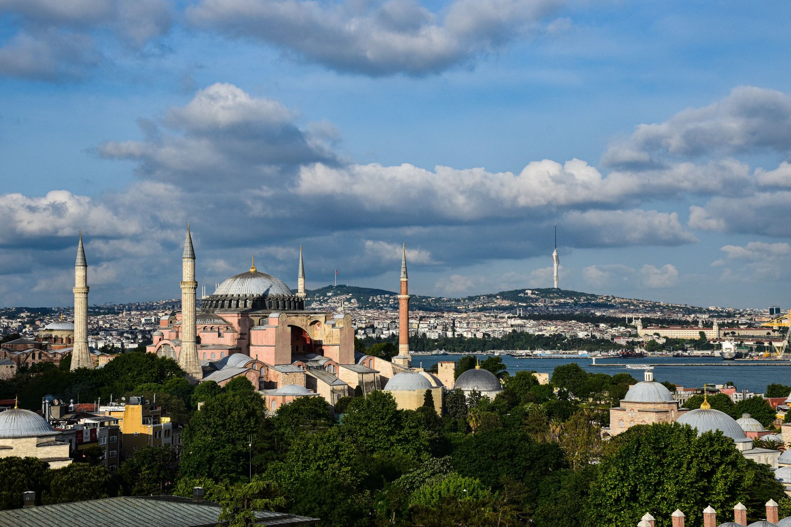 A scenic view of the iconic Hagia Sophia and Bosphorus in a vibrant Istanbul cityscape. Perfect for travel and architecture