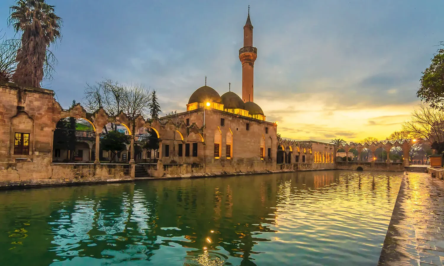 The Halil-ür Rahman Mosque reflected in the pool at sunset