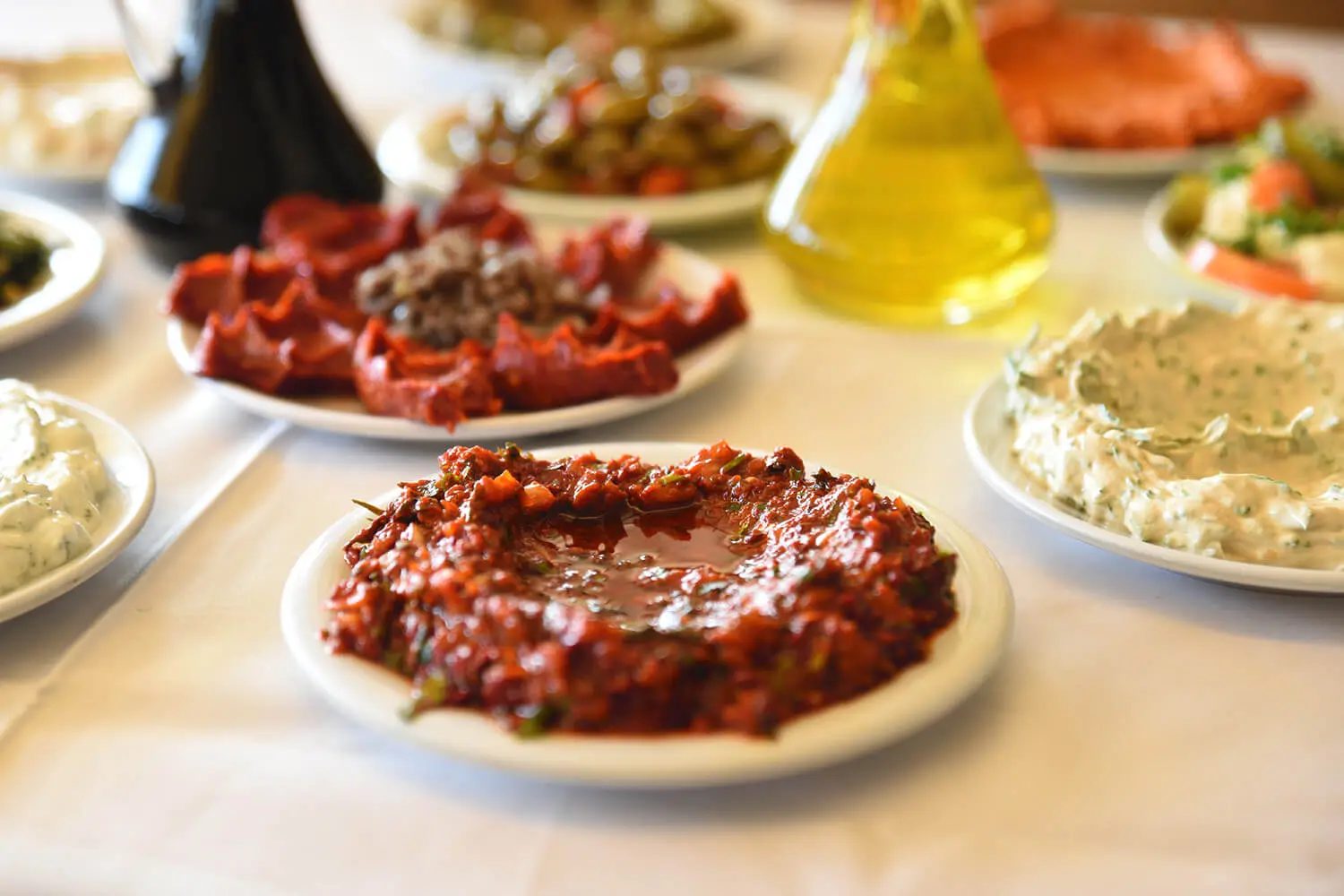 Hatay mezes: muhammara, hummus and olive oil