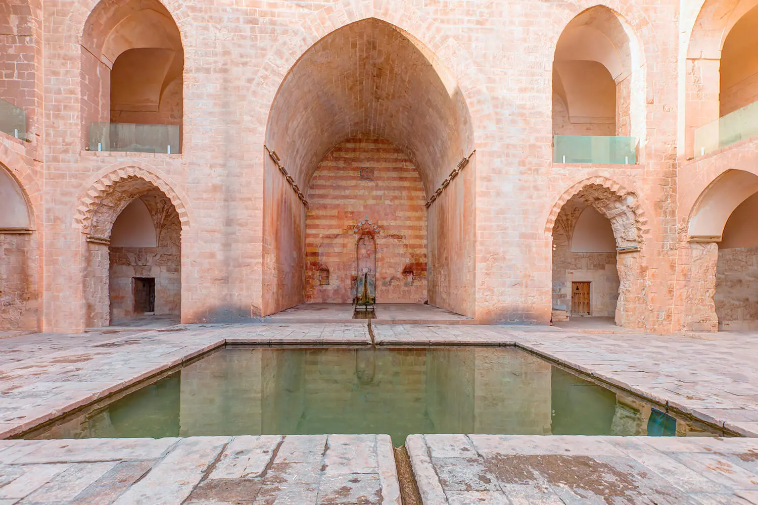 The iwan and water channel in the Kasımiye Madrasa courtyard