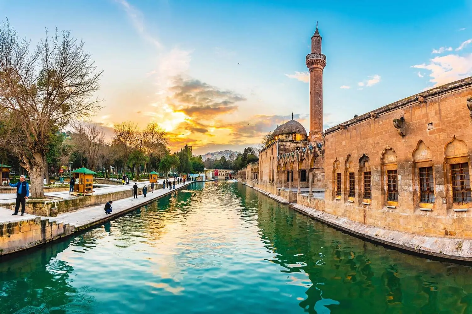 The Rizvaniye Mosque reflected in the Balıklıgöl canal at sunset