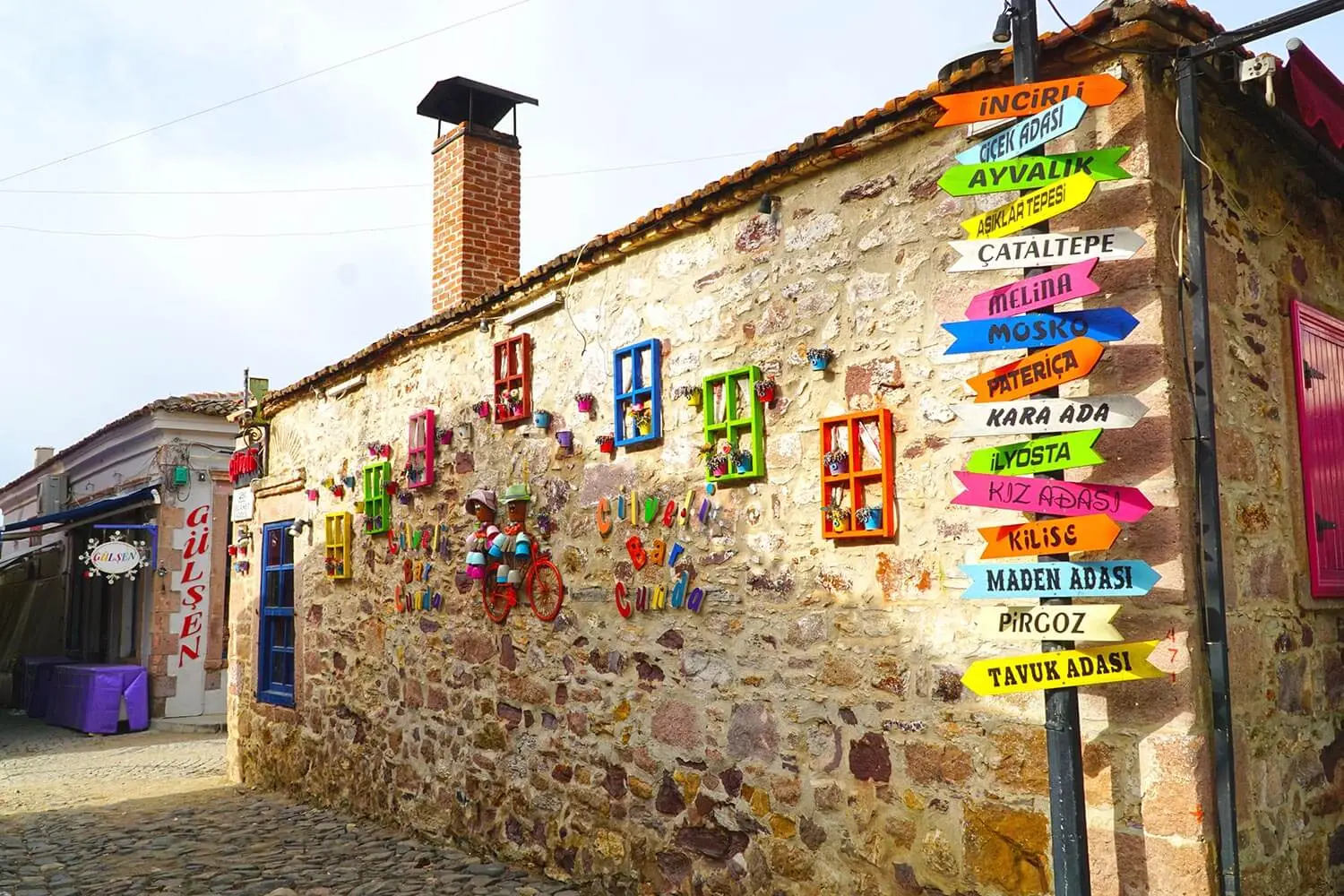 Signposts to the islands on a Cunda street