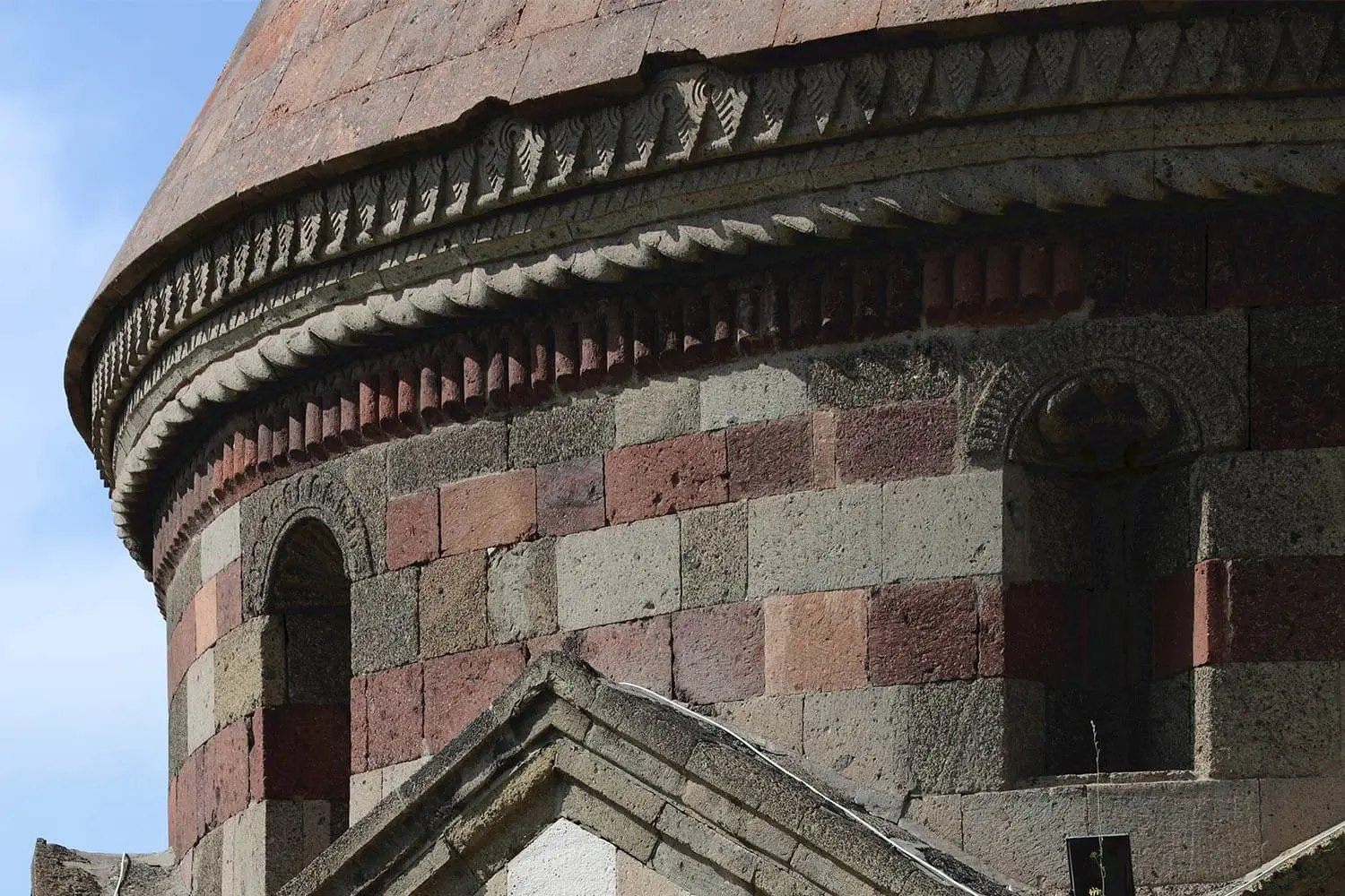 Stone detail on the drum of a tomb at the Üç Kümbetler