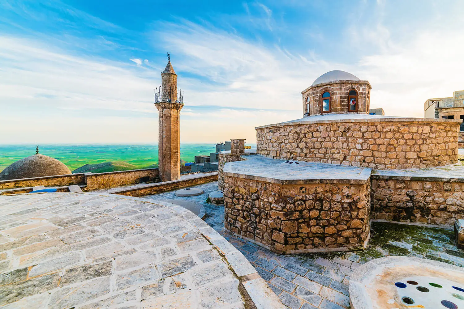 Stone rooftops and a minaret in Mardin's old town