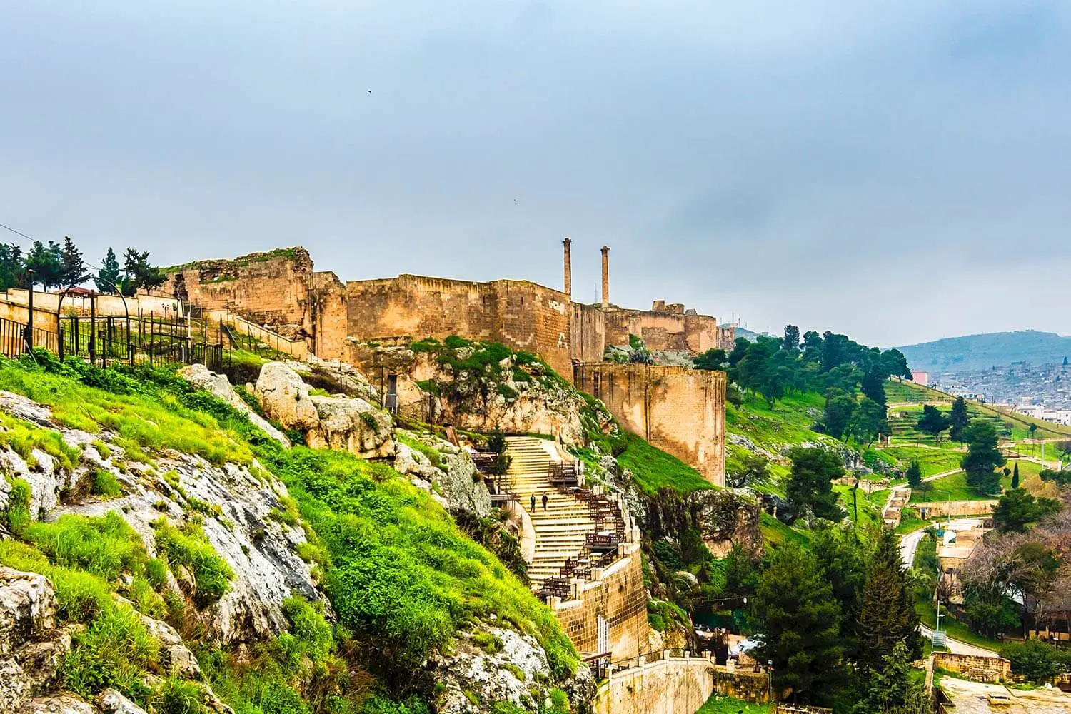 Walls of Şanlıurfa Castle above the green valley